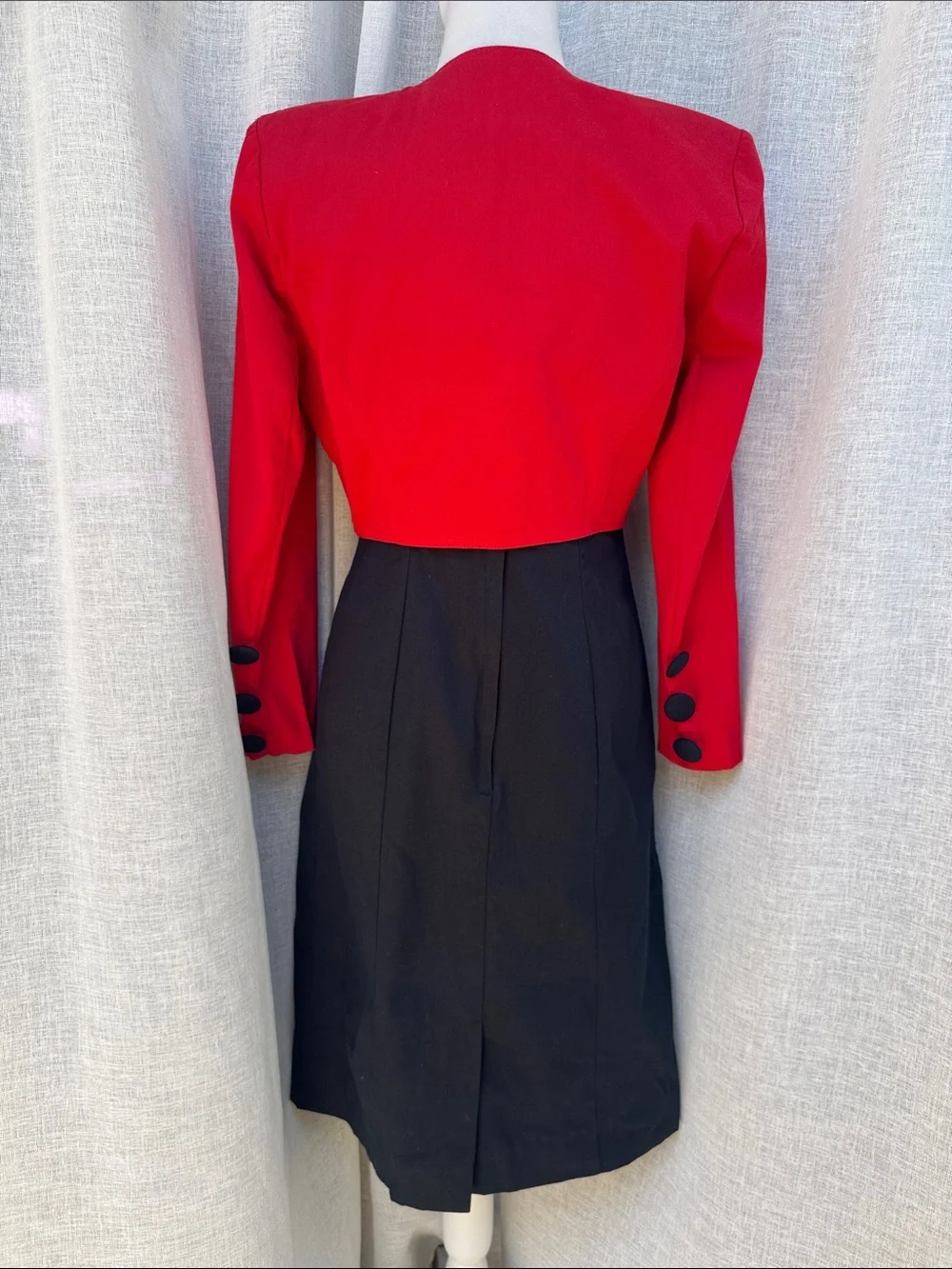 Jillian Arthur 1990s black strapless dress paired with a red bolero crop blazer